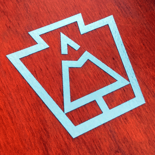 MTG Industries logo on stained deck top